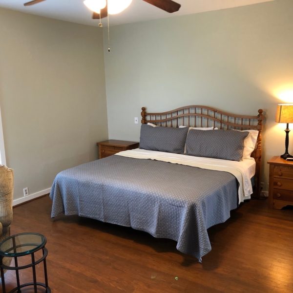 master bedroom with ensuite bath at oak creek ranch hunting lodge in columbus, tx